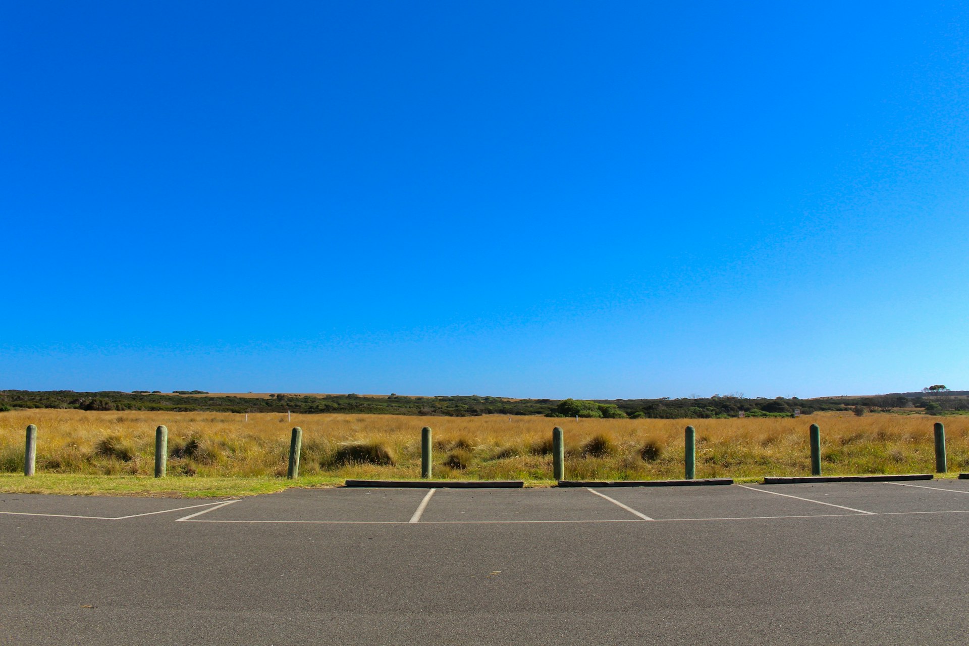 gray asphalt road under blue sky during daytime